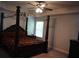 Bedroom with a four-poster bed and ceiling fan at 1504 Gallup Dr, Stockbridge, GA 30281