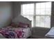 bedroom displaying a single bed under a window at 1504 Gallup Dr, Stockbridge, GA 30281