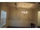 Elegant dining room featuring a coffered ceiling and a stylish chandelier at 1504 Gallup Dr, Stockbridge, GA 30281