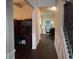 Hallway features a built-in office and staircase with iron railing at 1504 Gallup Dr, Stockbridge, GA 30281