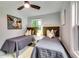 Charming bedroom with two twin beds and unique artwork at 2162 Westover Dr, Atlanta, GA 30344