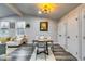 Open dining area with modern chandelier, table setting, and direct access to kitchen at 2162 Westover Dr, Atlanta, GA 30344