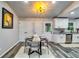 Dining area with table, white cabinets, and stainless steel appliances at 2162 Westover Dr, Atlanta, GA 30344