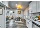 Bright, open-concept kitchen and dining area with modern lighting and stainless steel appliances at 2162 Westover Dr, Atlanta, GA 30344