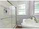 Bathroom with a modern glass shower and updated fixtures at 2701 Log Cabin Se Dr, Atlanta, GA 30339