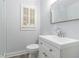 Updated bathroom features modern vanity, tile flooring, and shower with glass doors at 2701 Log Cabin Se Dr, Atlanta, GA 30339