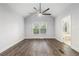 Bright bedroom features a vaulted ceiling, ceiling fan, and wood-look floors at 2701 Log Cabin Se Dr, Atlanta, GA 30339