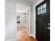 Home entryway with hardwood floors and view to an office/flex space with built-ins at 2701 Log Cabin Se Dr, Atlanta, GA 30339