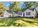 Charming single-story home with a well-manicured lawn and inviting curb appeal at 2701 Log Cabin Se Dr, Atlanta, GA 30339