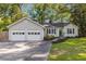 Beautiful home featuring a convenient two-car attached garage and manicured lawn at 2701 Log Cabin Se Dr, Atlanta, GA 30339