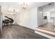 Open-concept living room and kitchen space with wood floors and modern fixtures at 2701 Log Cabin Se Dr, Atlanta, GA 30339