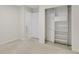 Bedroom with neutral walls and closet with shelving at 4870 Twin Lakes Trail, Atlanta, GA 30360