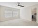Bedroom with carpet, ceiling fan, and bathroom access at 4870 Twin Lakes Trail, Atlanta, GA 30360