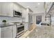 Updated kitchen featuring stainless steel appliances, granite counters and subway tile backsplash at 4870 Twin Lakes Trail, Atlanta, GA 30360
