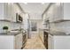 Modern kitchen featuring granite countertops, stainless steel appliances, and ample cabinet space at 4870 Twin Lakes Trail, Atlanta, GA 30360