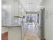 Updated kitchen featuring white cabinetry, granite countertops, and access to outdoor living space at 4870 Twin Lakes Trail, Atlanta, GA 30360