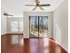 Bright living room with hardwood floors and sliding glass door leading to outdoor space at 4870 Twin Lakes Trail, Atlanta, GA 30360