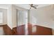 Living room with hardwood floors, ceiling fan, and sliding glass door at 4870 Twin Lakes Trail, Atlanta, GA 30360