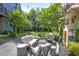 Picturesque backyard with outdoor lounge seating, elegant fountain, and meticulously maintained landscaping at 126 Chestnut Cir, Atlanta, GA 30342