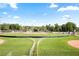 Baseball field at community park with open views, manicured grass, and bright blue sky at 126 Chestnut Cir, Atlanta, GA 30342