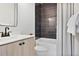 Bathroom features a dark tiled shower and tub combination, perfect for relaxation at 126 Chestnut Cir, Atlanta, GA 30342