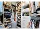 Organized walk-in closet with shelves and hanging rods for ample storage at 126 Chestnut Cir, Atlanta, GA 30342