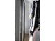 Hall closet features gray curtains with shelving and hanging rods for ample storage at 126 Chestnut Cir, Atlanta, GA 30342