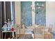 Cozy dining space enhanced by unique wall art, modern lighting, and a well-stocked bar cart at 126 Chestnut Cir, Atlanta, GA 30342