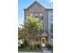 Stylish townhome featuring an elegant front entrance with a glass paneled door and manicured landscaping at 126 Chestnut Cir, Atlanta, GA 30342