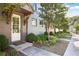 Charming entryway with white door and wood beam detailing, complemented by manicured landscaping at 126 Chestnut Cir, Atlanta, GA 30342