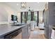 Open-concept kitchen flowing into the living area, featuring modern finishes and stainless steel appliances at 126 Chestnut Cir, Atlanta, GA 30342