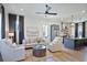 Spacious living room with open layout to the kitchen, stylish furnishings, and ample natural light at 126 Chestnut Cir, Atlanta, GA 30342