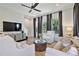 Cozy living room featuring a TV and neutral decor with plenty of natural light at 126 Chestnut Cir, Atlanta, GA 30342