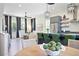 Inviting living space merging seamlessly with a kitchen featuring a modern island and stainless appliances at 126 Chestnut Cir, Atlanta, GA 30342