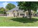 A bright backyard showing a large yard, patio, and rear elevation at 1478 Elena Dr, Mcdonough, GA 30253