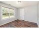 Cozy bedroom with hardwood floors, natural light, and a neutral color scheme at 1478 Elena Dr, Mcdonough, GA 30253
