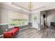 Cozy dining area featuring wood floors, bright windows and a chandelier at 1478 Elena Dr, Mcdonough, GA 30253