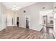 Open-concept living room featuring vaulted ceiling, wood-look floors, and an inviting atmosphere at 1478 Elena Dr, Mcdonough, GA 30253