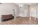 Bright living room with vaulted ceiling, wood-look floors, and ample space for entertaining at 1478 Elena Dr, Mcdonough, GA 30253