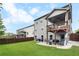 Back of the home featuring a covered deck and patio with a fenced-in backyard at 216 Orchard Trl, Canton, GA 30115