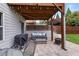 Outdoor patio area featuring a barbecue grill and comfortable seating arrangement at 216 Orchard Trl, Canton, GA 30115