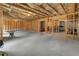 Unfinished basement awaiting your personal touch with exposed beams and concrete floors at 216 Orchard Trl, Canton, GA 30115