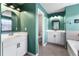 Dual sink bathroom featuring white cabinetry, modern mirrors, and stylish lighting for a luxurious feel at 216 Orchard Trl, Canton, GA 30115