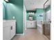 Dual sink bathroom featuring white cabinetry, modern mirrors, and stylish lighting for a luxurious feel at 216 Orchard Trl, Canton, GA 30115
