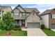 Charming two-story home with a well-manicured lawn and a two-car garage at 216 Orchard Trl, Canton, GA 30115