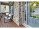 Cozy front porch with rocking chairs and decorative pillows, perfect for relaxing at 216 Orchard Trl, Canton, GA 30115