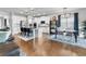Open-concept kitchen, dining, and living area with stainless appliances and ample seating at 216 Orchard Trl, Canton, GA 30115