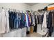 Well-organized walk-in closet features ample hanging space and shelving for optimal storage solutions at 216 Orchard Trl, Canton, GA 30115