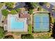 An aerial view of the community pool and tennis courts with lounge seating at 3600 Goldenrod Dr, Alpharetta, GA 30005