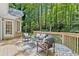 Cozy back deck with outdoor seating surrounded by lush greenery at 3600 Goldenrod Dr, Alpharetta, GA 30005